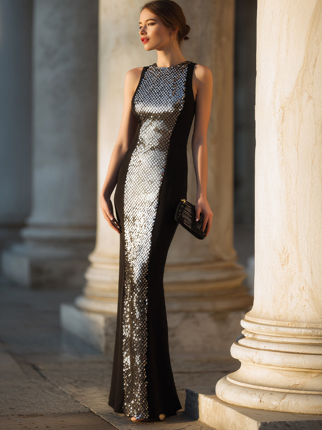 Black sleeveless evening gown with sculpted panels by FJØRNA, elegant dress for formal occasions.