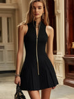 Black sleeveless mini dress for women by FJØRNA, featuring a fitted silhouette and stylish sleeveless design.