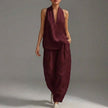 Elegant women's two-piece co-ord set from FJØRNA in claret with V-neck top and matching pants, featuring side pockets for summer wear.