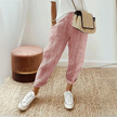 FJØRNA women's lightweight summer trousers with wide-leg fit and striped pattern, perfect for casual warm-weather wear.