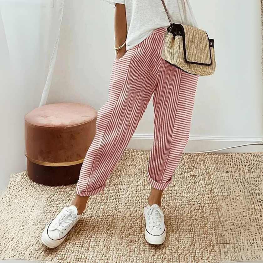 FJØRNA women's lightweight summer trousers with wide-leg fit and striped pattern, perfect for casual warm-weather wear.