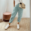 FJØRNA women's lightweight summer trousers with wide-leg design and blue and white striped pattern, perfect for warm weather.