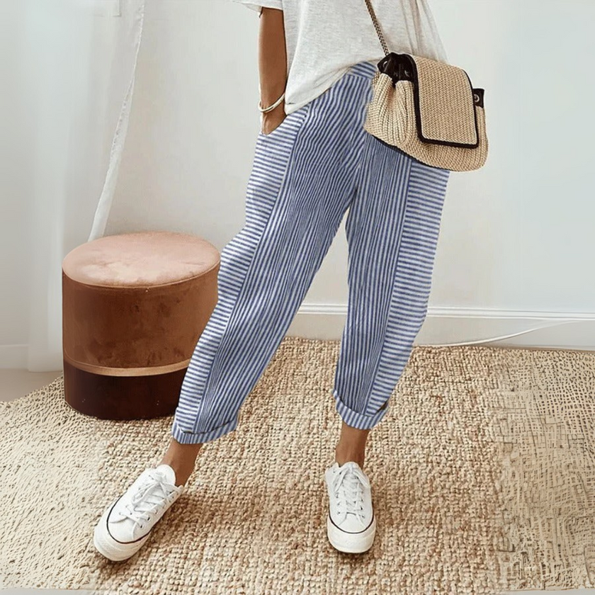 FJØRNA women's lightweight summer trousers with wide-leg design and vertical stripes, casual and breathable for warm weather.