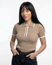 Black women's cotton polo top by FJØRNA, classic polo shirt with a collar and short sleeves, ideal for casual and stylish wear.