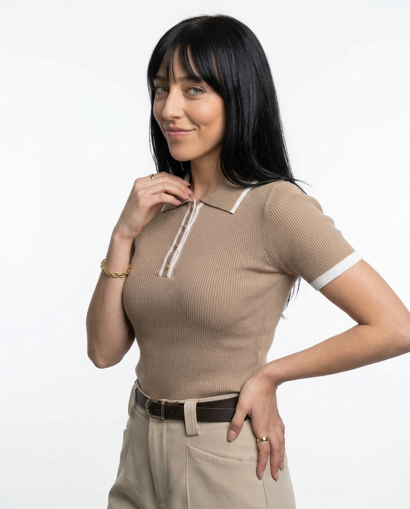 Black cotton polo top for women by FJØRNA, casual short-sleeve polo shirt with a classic collar and feminine fit.