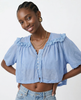 Cream cropped cotton blouse with lace trim, women's FJØRNA top featuring a stylish, feminine design and lightweight fabric.