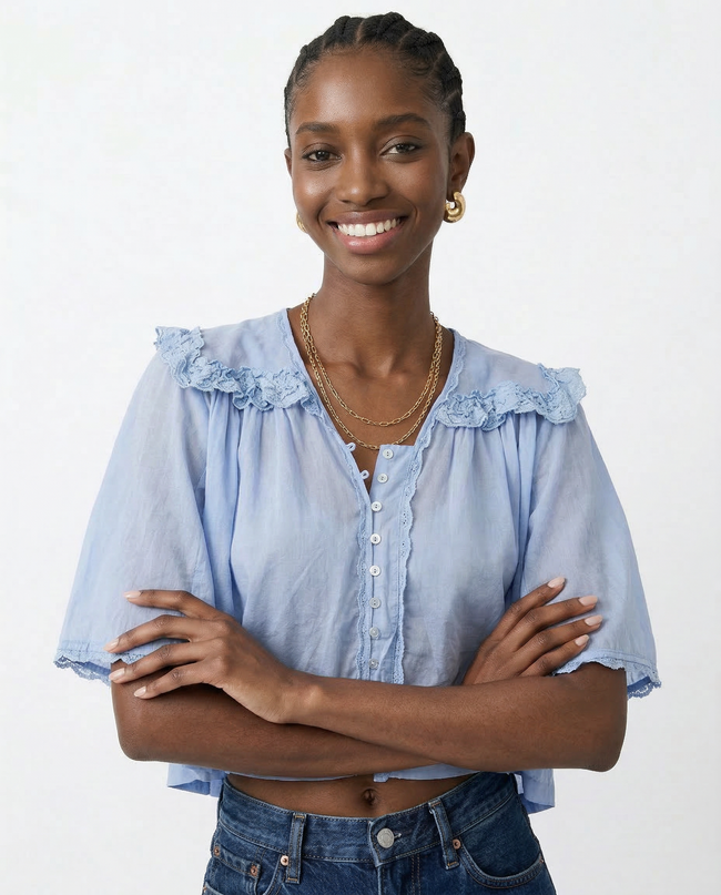 FJØRNA cream cropped cotton blouse with lace trim, stylish women's top featuring delicate detailing and a relaxed fit.