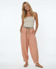 FJØRNA women's linen tapered trousers, stylish and comfortable pants with a relaxed fit, shown on a model.