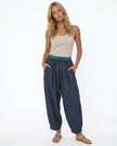 Light beige linen tapered trousers for women by FJØRNA, featuring a relaxed fit and casual style.