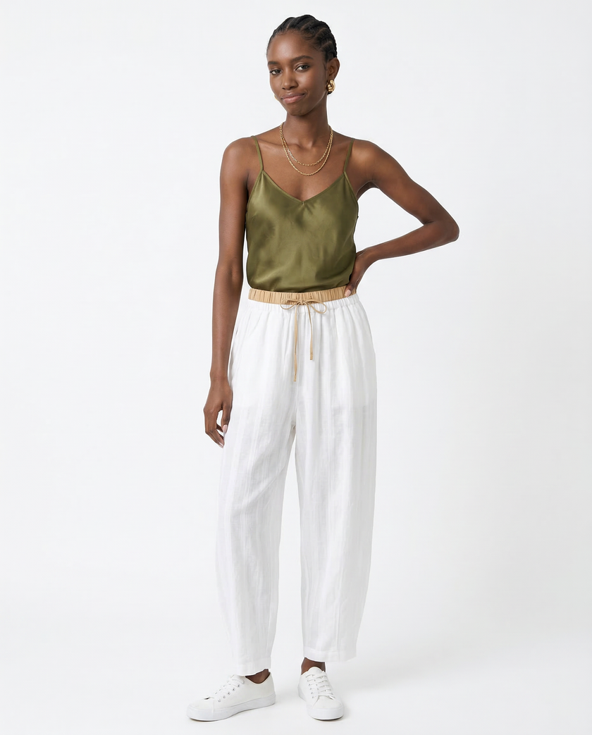 FJØRNA women's linen tapered trousers, lightweight and breathable pants, featuring a relaxed fit and classic design.