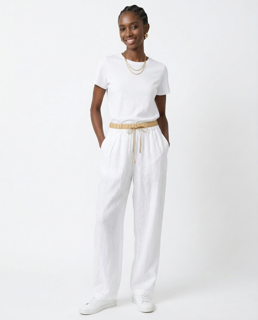 FJØRNA women's linen tapered trousers, lightweight and stylish pants, displayed on a neutral background.