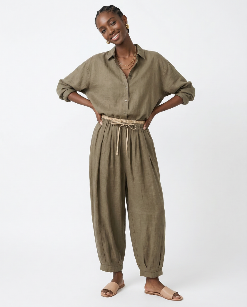 Light beige FJØRNA linen tapered trousers for women, featuring a relaxed fit and stylish design.