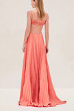 FJØRNA Sunset Cutout Plisse Maxi Dress, elegant cocktail dress with sunset-inspired cutout design and flowing pleated fabric.
