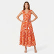 Women's sleeveless floral print boho maxi dress with tie neck by FJØRNA, showcasing a flowing design and vibrant pattern.