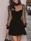 FJØRNA velvet evening dress displayed on a hanger, showcasing its elegant fabric and classic silhouette.