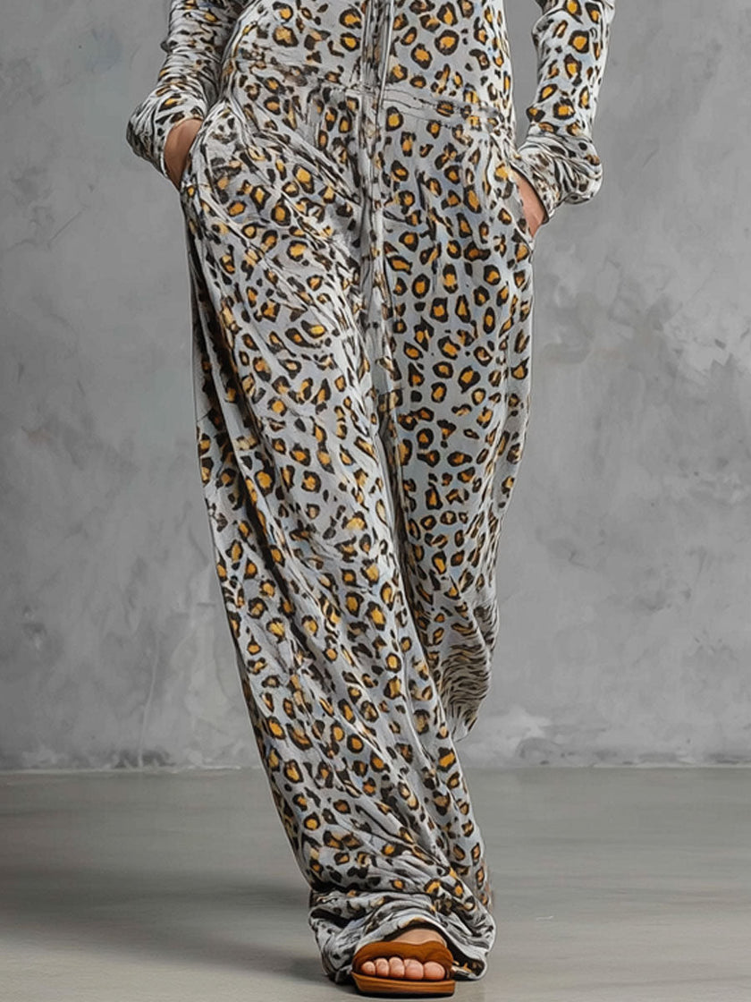 Grey velvet leopard print hooded wide-leg jumpsuit for women, stylish FJØRNA pants with relaxed fit and trendy animal pattern.