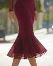 Burgundy sheer high-neck mermaid midi dress by FJØRNA, featuring a fitted silhouette and elegant cocktail dress style.