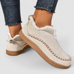 FJØRNA women's orthopedic slip-on shoes with zip-up closure, heeled design, and arch support for comfortable footwear.