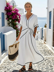 Flowy FJØRNA summer midi dress for women with short sleeves, wrap style, breathable fabric, perfect for warm weather.
