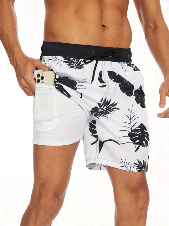Men's FJØRNA secure fit swim shorts in blue, designed for beach swimwear, with a comfortable waistband and quick-dry fabric.