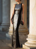 Black sleeveless FJØRNA evening gown with sculpted panels, elegant design, perfect for formal black tie events.