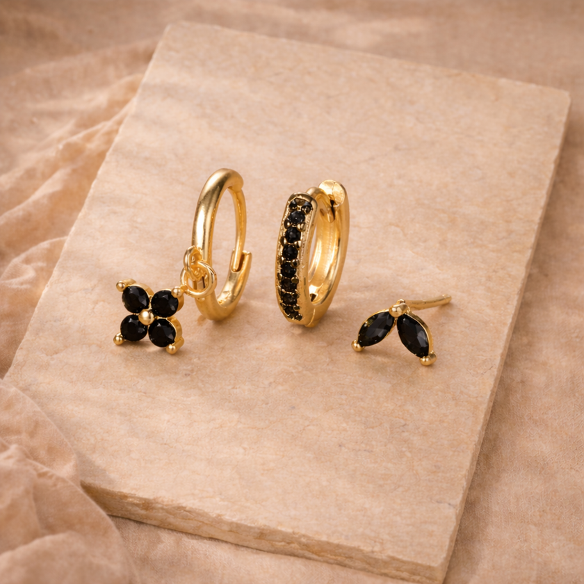 Unisex minimalist piercing set by FJØRNA featuring stainless steel hoops and stud earrings for women.