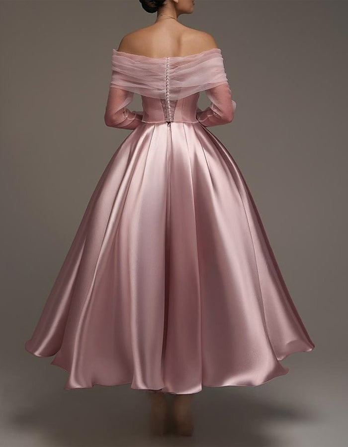 Pink satin midi dress for women by FJØRNA, strapless A-line design with shawl and strappy details, elegant evening wear.