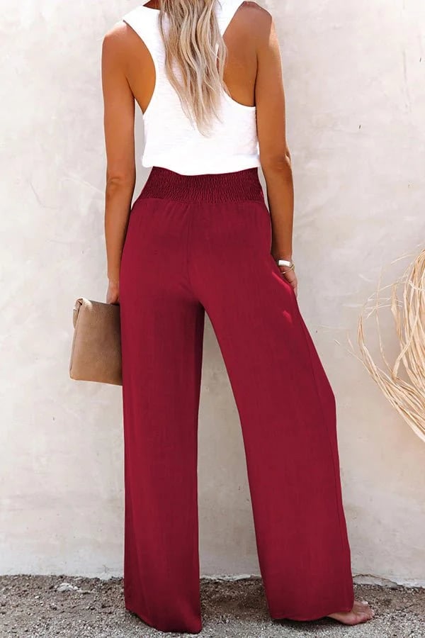 FJØRNA women's lightweight summer trousers with high waist and smocked design, shown in a relaxed fit with soft fabric.