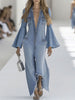 Light blue denim flared long sleeve jumpsuit for women by FJØRNA, featuring wide-leg pants and a stylish, relaxed fit.