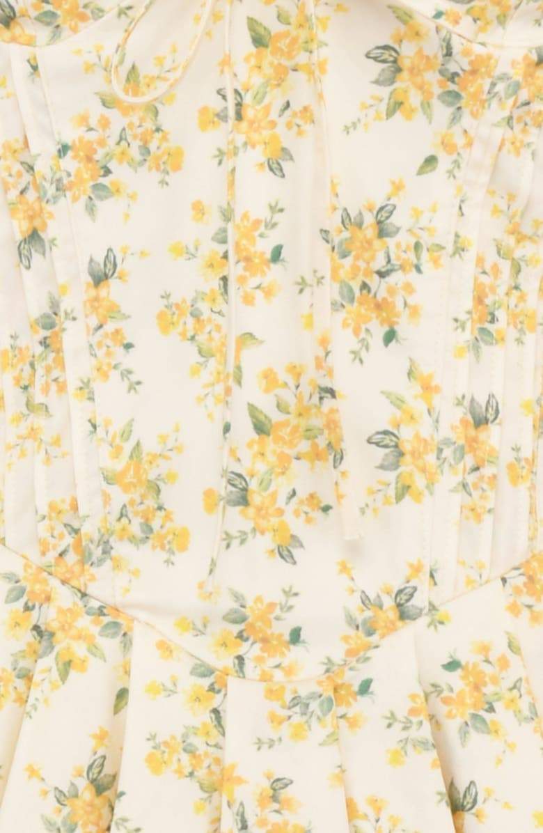 FJØRNA Emily Floral V-neck Corset Mini Dress in white, featuring a fitted bodice and floral pattern, short length for a stylish look