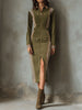 Olive green FJØRNA sleeveless midi dress with zip-up front and contrast panel design, perfect for casual or semi-formal occasions.