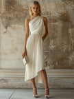 White pleated midi dress by FJØRNA featuring elegant evening dress design and flowing fabric, ideal for formal occasions.
