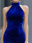 Royal blue velvet halter bodycon mini dress by FJØRNA, close-up of fitted cocktail dress with halter neckline and smooth velvet fabric.