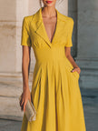 FJØRNA collared short-sleeve midi dress with structured waist, showcasing a stylish, elegant design perfect for women.