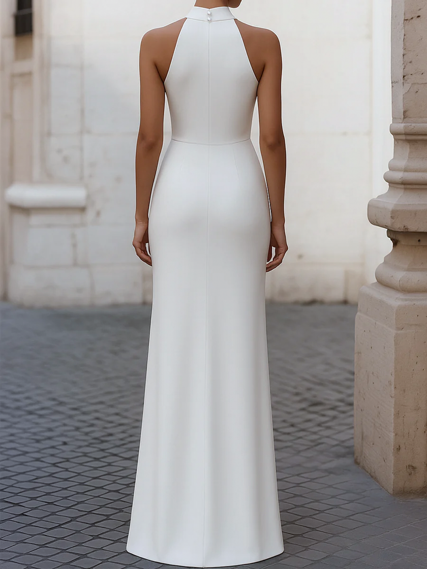 White satin pleated halter evening gown by FJØRNA featuring elegant design for formal black tie events.