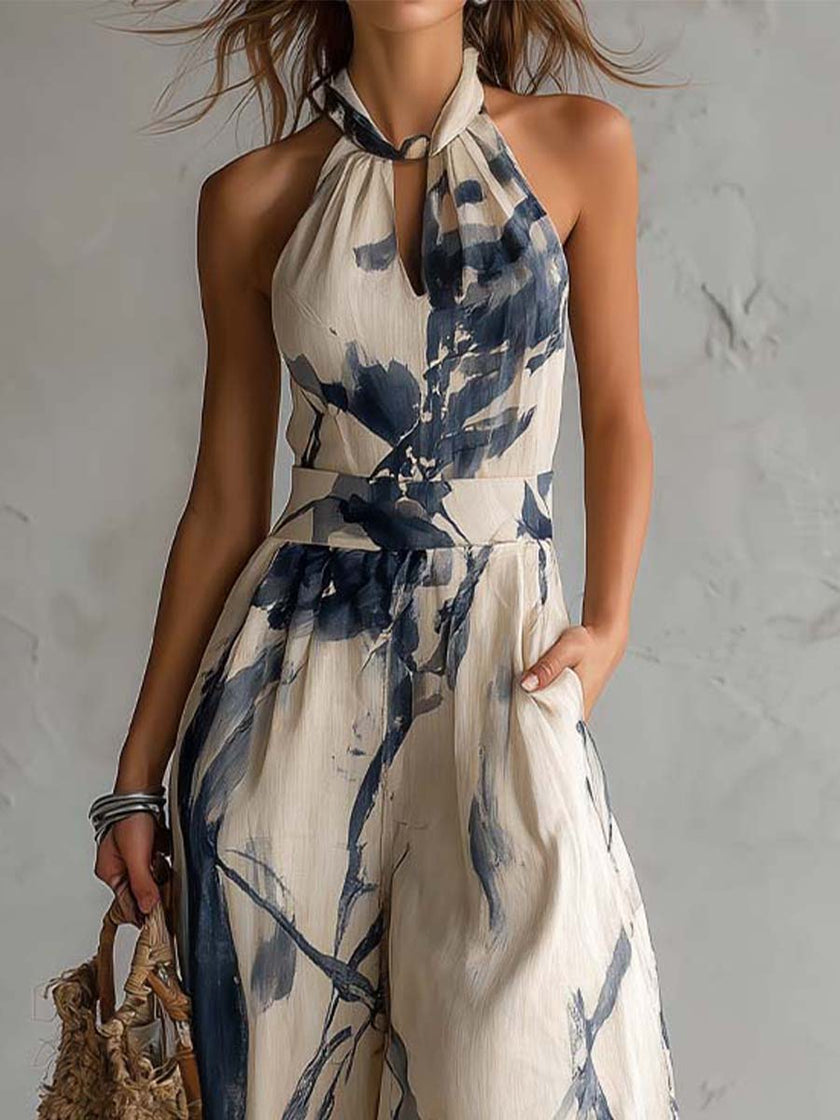White ink wash print halter neck wide-leg jumpsuit with pockets for women by FJØRNA, showcasing a stylish, comfortable design.