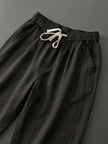 FJØRNA women's lightweight summer trousers with drawstring, breathable casual pants in a relaxed fit, suitable for warm weather.