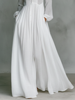 FJØRNA white maxi dress with stand collar, button front, and long sleeves, elegant and flowing for a stylish look.