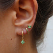 FJØRNA unisex minimalist piercing set with gold and green stainless steel hoops and studs, stylish accessories for women.