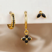 Unisex minimalist piercing set by FJØRNA featuring gold and green stainless steel hoops and studs for women.