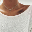 Gold 3-layer pearl pendant necklace set for women by FJØRNA, featuring layered gold and silver necklaces with heart and cross pendants.