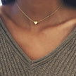 Gold 3-layer pearl pendant necklace set for women by FJØRNA, featuring layered gold and silver necklaces with heart or cross pendants.