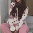 FJØRNA Sophie women's Christmas jumper in white, cozy knit sweater with festive holiday design and comfortable fit.