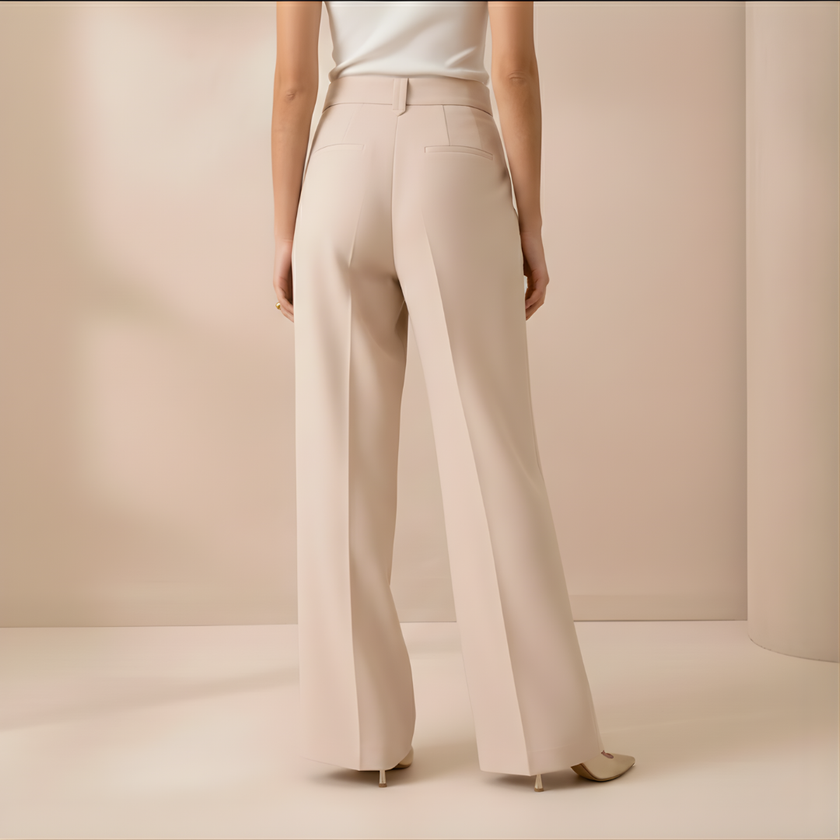 Beige FJØRNA high-waist wide-leg women’s pants, loose pull-on trousers with relaxed fit and tailored style.