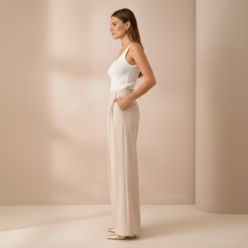 Beige high-waist wide-leg tailored pants for women by FJØRNA, loose pull-on style, perfect for casual or professional wear.