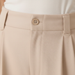 Beige high-waist, wide-leg pull-on pants for women from FJØRNA, featuring a tailored, loose fit and comfortable design.