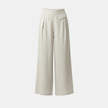 White cotton linen wide-leg trousers for women by FJØRNA, high waist with pockets, relaxed fit, stylish and comfortable.