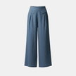 White high-waist cotton linen wide-leg trousers for women by FJØRNA, featuring pockets and a relaxed fit.