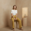 White high-waist cotton linen wide-leg trousers for women with pockets, by FJØRNA, styled with a relaxed fit and wide legs.
