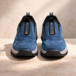 Men's FJØRNA orthopedic hiking boots in blue, supportive walking shoes for comfort and durability during outdoor adventures.